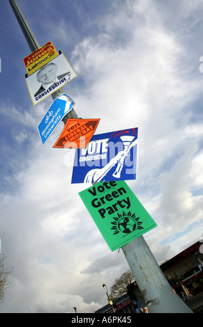 An array of election signs on a lamp post in Selly Park Birmingham England during the 2005 General Election Stock Photo