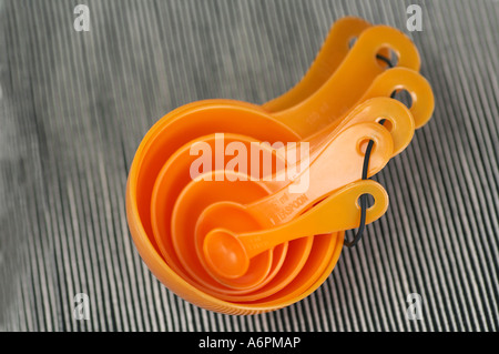 Measuring spoons on grey setting utensil Stock Photo