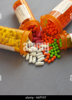 Pills spilling from Containers Stock Photo