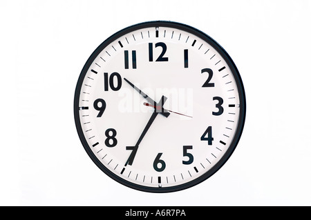 closeup of wall clock in office Stock Photo