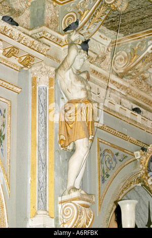 pigeons perching on exquisite Plasterwork in the 2001 earthquake damaged Darbargadh Palace at Bhuj in Gujarat India Stock Photo