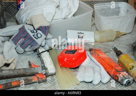 tools and gloves on workbench Stock Photo