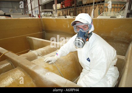 boat builder cleaning mould ready for gel coating Stock Photo