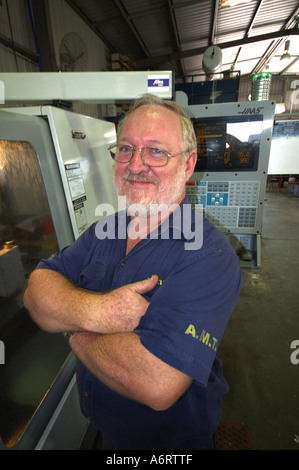 mature worker in metal workshop Stock Photo