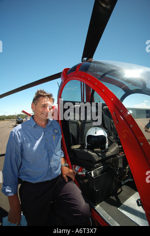 chopper pilot performing pre flight checks Stock Photo