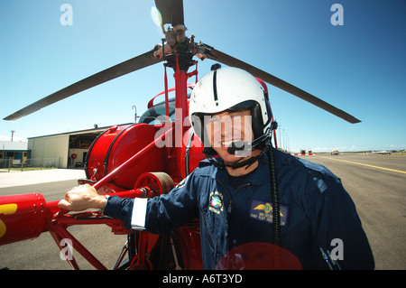 chopper pilot performing pre flight checks Stock Photo