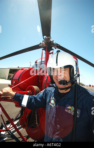 chopper pilot performing pre flight checks Stock Photo