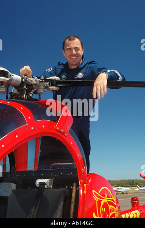 chopper pilot performing pre flight checks Stock Photo