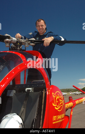 chopper pilot performing pre flight checks Stock Photo