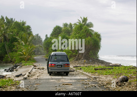 Tuvaluans watch as the high tide inundates their island home on funafuti, threatened by global warming induced sea level rise Stock Photo