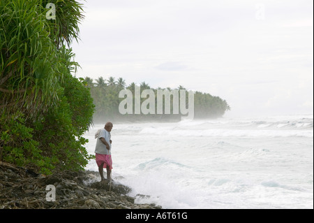 Tuvaluans watch as the high tide inundates their island home on funafuti, threatened by global warming induced sea level rise Stock Photo