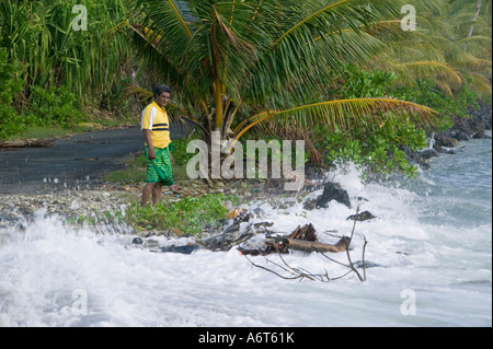 Tuvaluans watch as the high tide inundates their island home on funafuti, threatened by global warming induced sea level rise Stock Photo