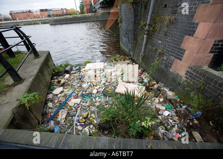 Plastic bottles containers and other rubbish thrown into the canals are collected along the banks in an attempt to clean up the Stock Photo