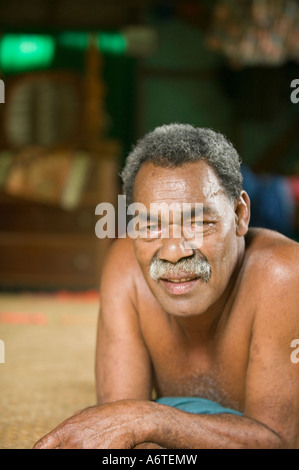 A Fijian man in his hut in Bukaya village, Fijian Highlands Stock Photo