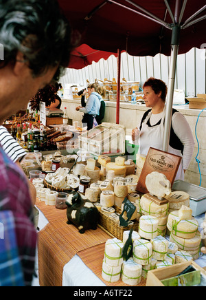 Organic fruits vegetables cheeses breads and other foods at the Temple Bar Saturday morning market - Dublin Ireland Stock Photo