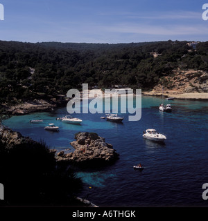 Scene with leisure boats, beach and beach restaurant in the bay / anchorage of Portals Vells, Calvia South West Mallorca, Balear Stock Photo