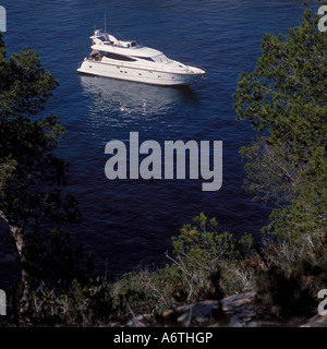 Scene with leisure boat in the bay / anchorage of Portals Vells, Calvia South West Mallorca, Balearic Island, Spain. 26th March Stock Photo