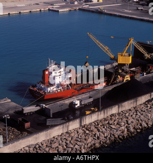 Aerial image - Bulk Coal Carrier 'Playa de Alcudia' discharging coal on the coal import quay in the Puerto de Alcudia / Alcudia. Stock Photo