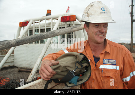 Mine engineer worker leaning on his vehicle Stock Photo