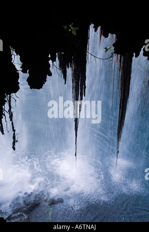 The upper Duden waterfall called Alexander Falls as well seen through a cave beneath located on the Duden River in the province of Antalya, Turke Stock Photo