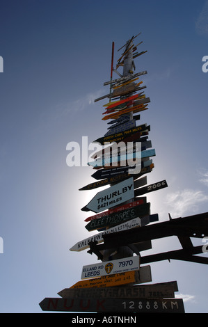 The Totem pole filled with the names of towns in Great Britain on Stanley By-pass, Falkland Islands Stock Photo