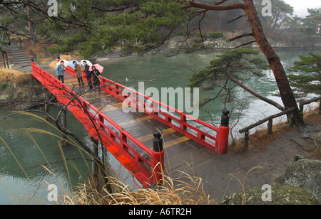 Japan Nothern Honshu Miyagi ken Matsushima bay Oshima island view from the island with traditional red bridge on a rainy day and Stock Photo