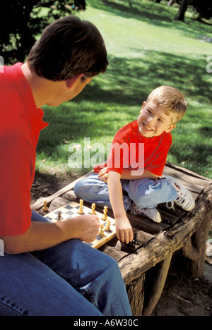 Family Father and son playing chess Stock Photo