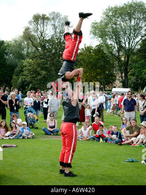 Two female Street Performers performing balancing act at the Edinburgh Fringe Sunday Festival Scotland UK 2004 Stock Photo