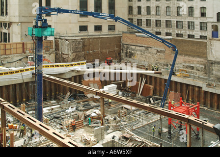 London deep foundations for new office block under construction showing ready mix concrete placement pump Stock Photo