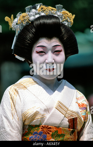 A Japanese geisha poses in her traditional outfit in Tokyo Japan Stock
