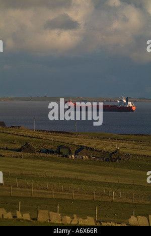 dh Oil tanker SHIPPING UK Oiltanker anchorage awaiting oil transfer in Scapa Flow and cottage vessel scotland