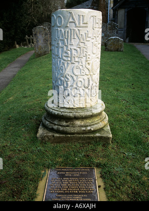 SHERE SURREY UK November Millennium stone in the churchyard of St James's Church with a verse by John Wesley on a metal plaque Stock Photo