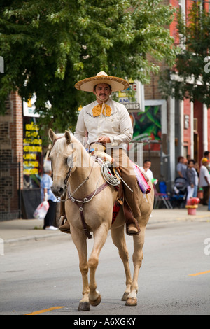 ILLINOIS Chicago Man dressed in traditional cowyboy costume ride horse in Mexican Independence Day Parade Pilsen Stock Photo