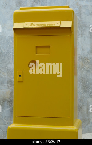 An old yellow post box Israel Stock Photo