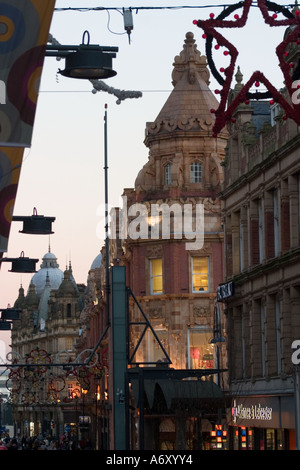 Towards Briggate from Albion Place with Christmas decorations Corner of Debenhams Building Leeds Stock Photo