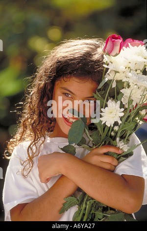 Portrait of teen girl with bouquet of flowers Stock Photo - Alamy