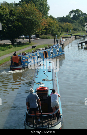 Narrow Boats Moving Down Canal at Hatton Grand Union Canal Warwickshire England United Kingdom UK Stock Photo