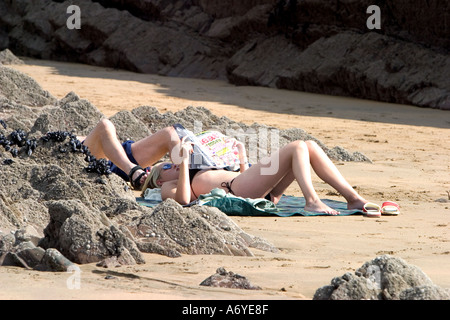 Relaxing on a beach Cornwall England Stock Photo
