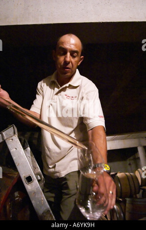 Sylvain Fadat Domaine d'Aupilhac. Montpeyroux. Languedoc. Pouring a wine sample in a glass. Owner winemaker. France. Europe. Stock Photo