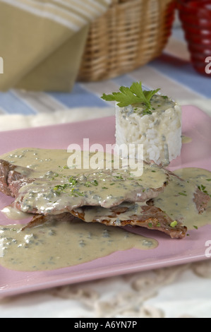 Charcoil grilled scalloppini cutlets with Cabrales cheese sauce Stock Photo