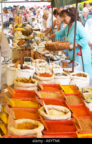 Spice seller at a market. Customers. Collioure. Roussillon. France. Europe. Stock Photo