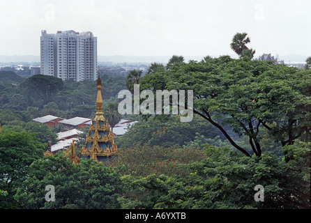 Maya Wizaya Pagoda and modern tower block juxtaposed seen from the Shwedagon Rangoon Yangon Burma Myanmar Stock Photo