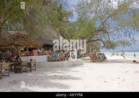 Tourists relaxing at Forty Thieves restaurant Diani Beach South Coast near Mombasa Kenya East Africa Stock Photo