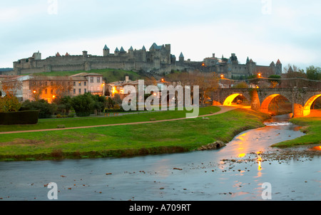 Carcassonne. Languedoc. View over the old city. The old bridge across the Aude river. Illuminated in early morning. A rainy and Stock Photo
