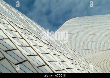 Sydney Opera House taken from a close up abstract angle with a blue sky above showing detail of roof material Stock Photo
