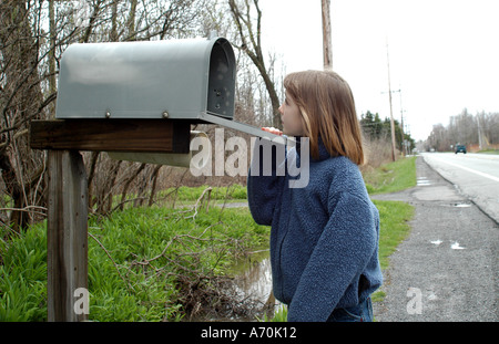 Child looking for mail Stock Photo