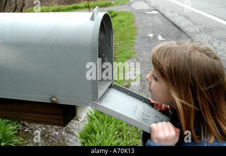 child looking for mail Stock Photo