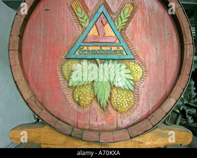 artistic carvings on old wooden barrel in Bavarian beer museum in Kulmbach Frankonia Germany Stock Photo