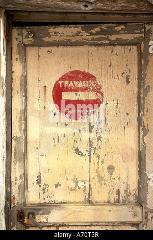 No parking sign on an old door in the South of France Stock Photo