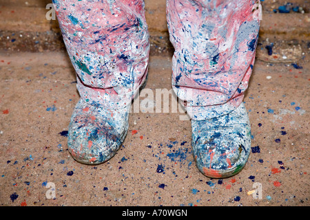 Paint spotted trousers Painters clothing or overalls with splashes on legs and shoes of painter at Macduff north-eastern ship yard Scotland, UK Stock Photo